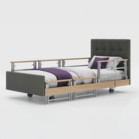 Opera Beds Signature Comfort Plus Profiling Bed with adjustable headboard, side rails and wheels, front view.