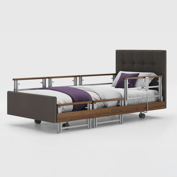 Profiling bed with leatherette frame, adjustable side rails, and wheels, front view.