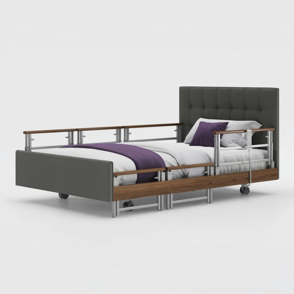 Opera Beds Signature Comfort Plus Profiling Bed with wood accents, white bedding, purple blanket and pillow, front view.
