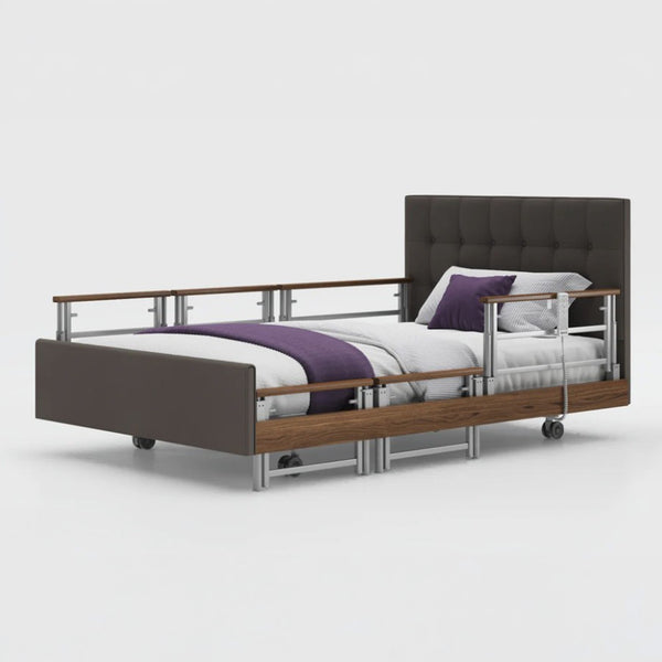 Opera Beds Signature Comfort Plus Profiling Bed with upholstery, white bedding and purple blanket, side view.