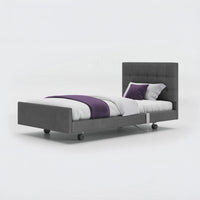 Opera Beds Signature Comfort Profiling Bed with white bedding and purple accents on a white background, front view.