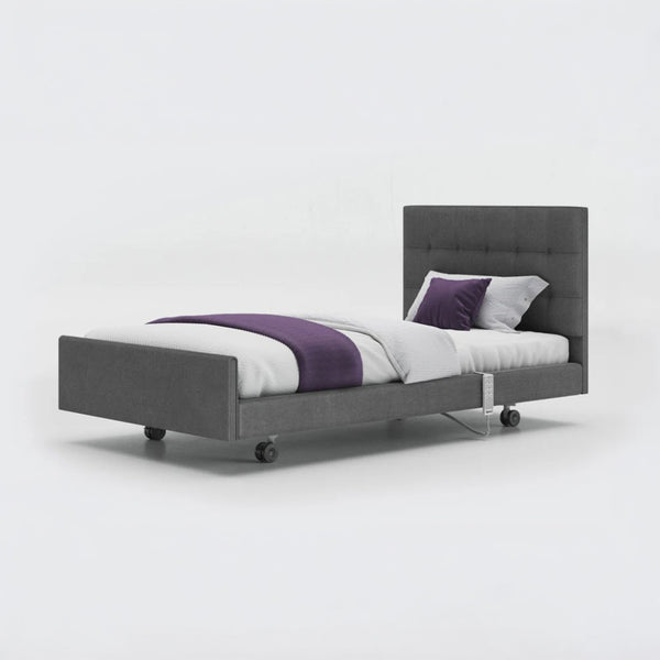 Opera Beds Signature Comfort Profiling Bed with white bedding and purple accents on a white background, front view.