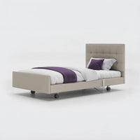 Opera Beds Signature Comfort Profiling Bed with white bedding and purple accents on a white background, front view.