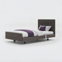 Profiling bed with padded headboard, frame, and accents on wheels, leatherette finish, Signature Comfort design, front view.