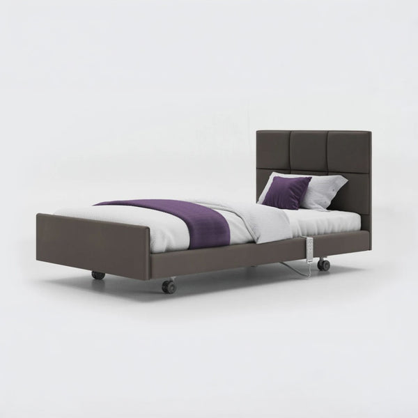 Profiling bed with frame, headboard, white bedding, purple blanket and rails, leatherette finish, front view.