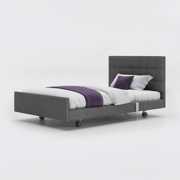 Opera Beds Signature Comfort Profiling Bed with white bedding and purple blanket, plain background, front view.