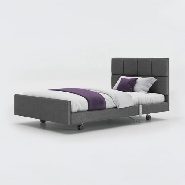 Opera Beds Signature Comfort Profiling Bed with white bedding and purple throw on plain background, front view.