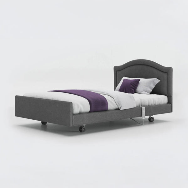 Opera Beds Signature Comfort Profiling Bed with white bedding, purple blanket, and wheels, side view.
