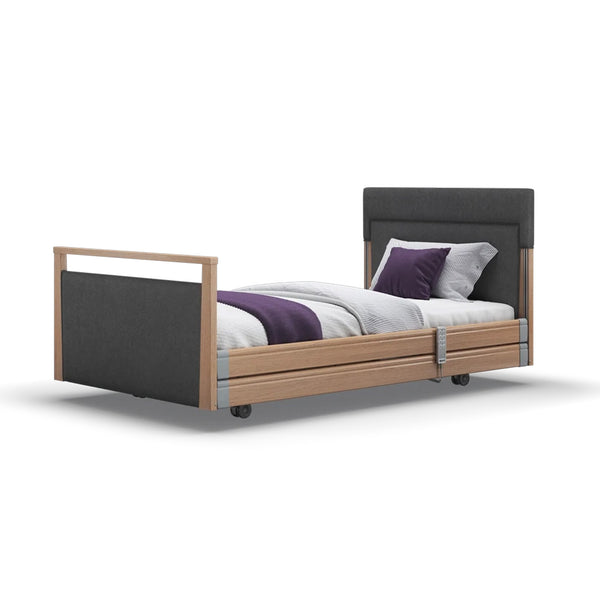 Signature Upholstered Profiling Bed with wood accents, white bedding and a purple blanket, front view.