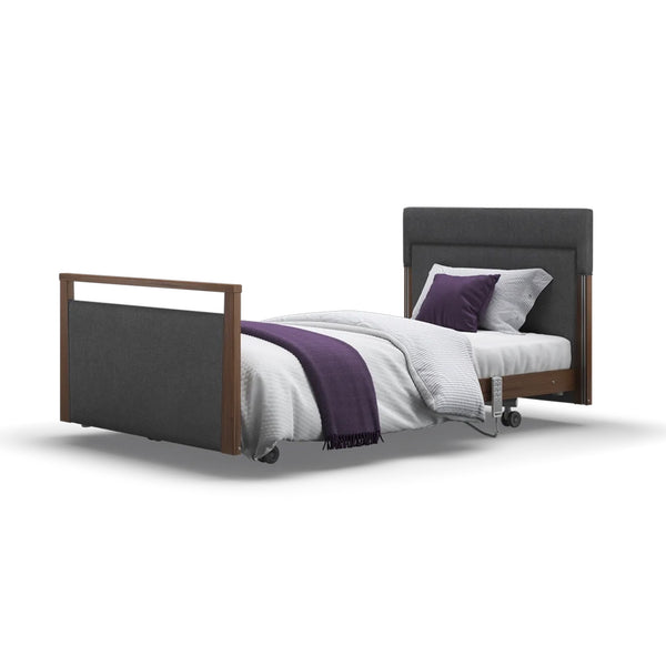 Opera Beds Signature Upholstered Profiling Bed with adjustable frame, white bedding and purple blanket, front view.