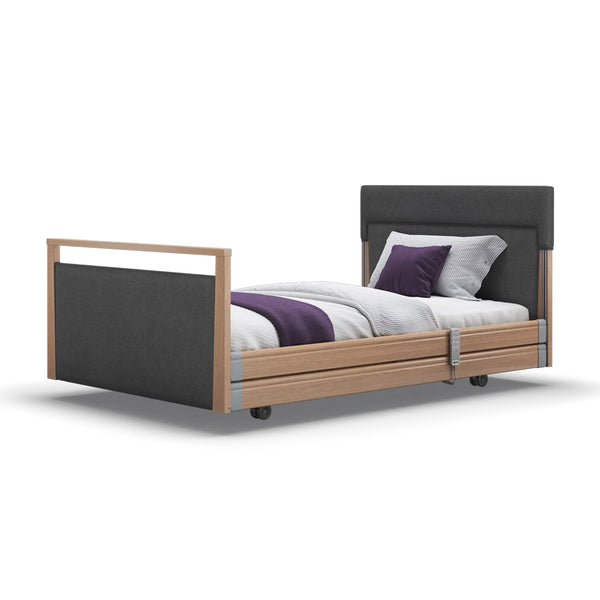 Signature Upholstered Profiling Bed by Opera Beds with white bedding and purple accents, side view.