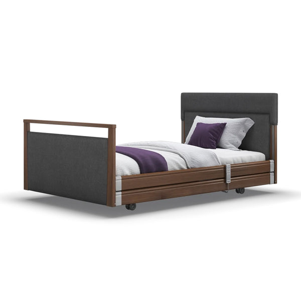 Opera Beds Signature Upholstered Profiling Bed with white bedding and purple pillows on a white background, front view.