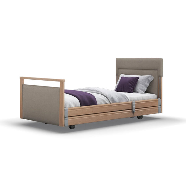 Opera Beds Signature Upholstered Profiling Bed with wooden frame, upholstered headboard, white bedding and purple accents, front view.