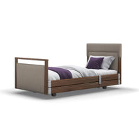 Opera Beds Signature Upholstered Profiling Bed with wood accents and bedding, linen fabric finish, white background, front view.