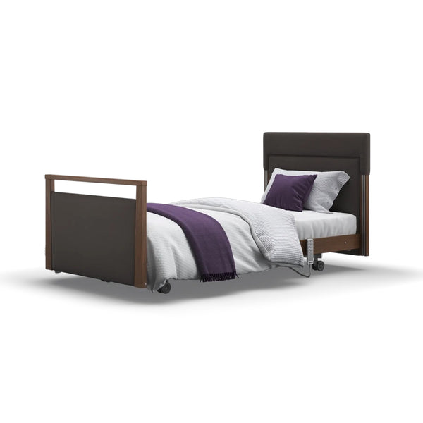 Opera Beds Signature Upholstered Profiling Bed with white bedding, purple blanket and two pillows on a white background, front view.