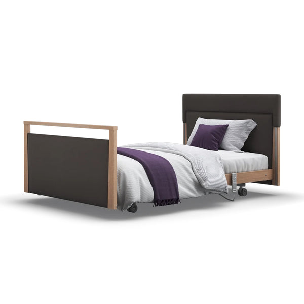Signature Upholstered Profiling Bed by Opera Beds with leatherette frame and white bedding, white background, front view.