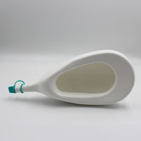 Homecraft Slipper Urinal with teal cap, plastic design, shown lying on its side on plain white background, side view.