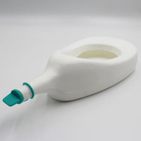 Homecraft Slipper Urinal with cap, shown on plain surface, side view.