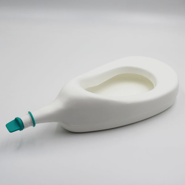 Homecraft Slipper Urinal with cap on plain white surface, angled side view.