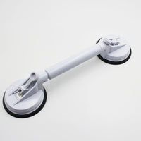 Small adjustable suction cup grab bar for bathroom or shower support, shown attached to smooth surface, side view.