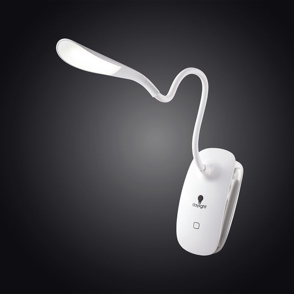 The Daylight Company Smart Clip-On Lamp with touch button, illuminated against a dark background, front view.