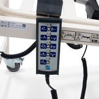 Sidhil Solite Pro Electric Bed remote with bed adjustment buttons, attached to the bed side, close-up.