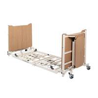 Drive Solite Pro Ultra Low Bed with wooden headboard, metal frame, wheels and low height for safer use, side view.