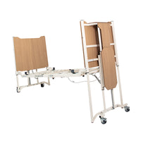 Drive Solite Pro Ultra Low Bed with wooden panels and foldable metal legs on wheels, ultra low design for safety, front view.