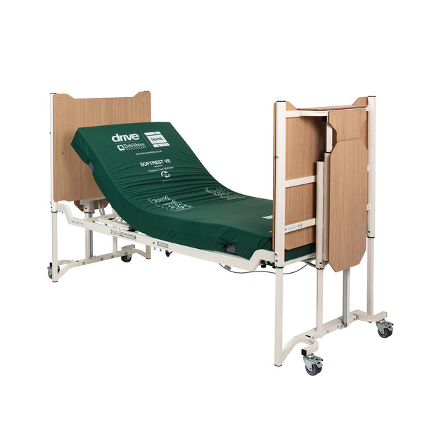 Drive Solite Pro Ultra Low Bed with mattress, wooden head and footboards, and wheels, shown from side view.