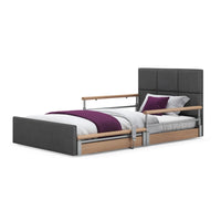 Opera Beds Solo Comfort Plus Profiling Floor Bed with side rails, white bedding, purple blanket and pillow, front view.