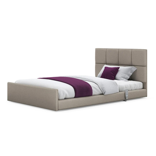 Opera Beds Solo Comfort Profiling Floor Bed with tall tufted headboard and purple-white bedding, angled view.