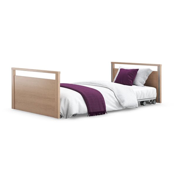 Opera Beds Solo SafeSide Profiling Floor Bed with white bedding, purple throw and pillow, on white background, front view.