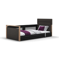 Opera Beds Solo SafeSide Floor Bed with safety rails, white bedding, and purple accents on white background, front view.