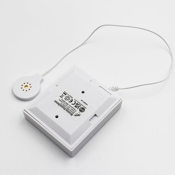 Hearing Products International Sound Sensor Transmitter with attached round corded sensor, tabletop view.