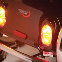 Illuminated rear lights and suspension on Drive Sport Rider Scooter, close-up.