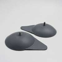 Mountway Suckers for Neptune Bath Lift with metal studs and angled bases on a plain surface, top view.