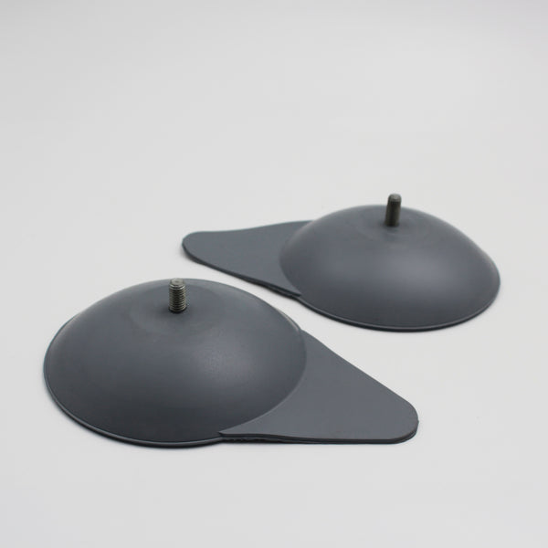 Mountway Suckers for Neptune Bath Lift with metal studs and angled bases on a plain surface, top view.