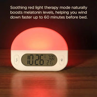 Lifemax Sunrise Alarm Clock with light dome, digital display for time, date and temperature on wood surface, front view.