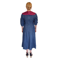 Woman wearing a Care Designs Tabard Style Adult Bib, back view.