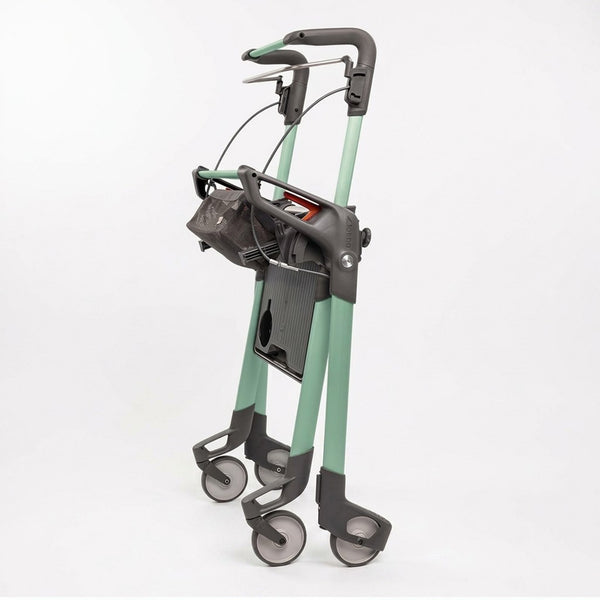 Topro Hestia Indoor Rollator with retractable black handles, adjustable handrail, mesh bag and four wheels, side view.
