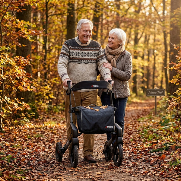 Older man using Topro Olympos All Terrain Rollator walking on a path by a lake with greenery, in use view.
