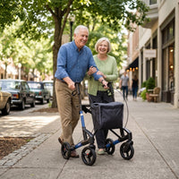 Older man using a Topro Troja 5G Premium Rollator with companion, outdoors, in use.