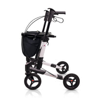 Topro Troja 5G Premium four-wheel rollator with black handles and mesh storage bag, front view.