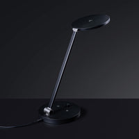 The Daylight Company TriSun Therapy Lamp with adjustable brightness and touch controls, desk lamp front view.