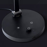 The Daylight Company TriSun Therapy Lamp base showing brightness control, power knob, USB port and cable, close-up view.
