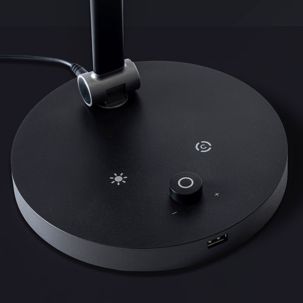 The Daylight Company TriSun Therapy Lamp base showing brightness control, power knob, USB port and cable, close-up view.