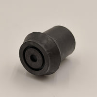 Coopers Walking Stick Ferrule, cylindrical rubber with central hole, shown on a plain surface, close-up view.