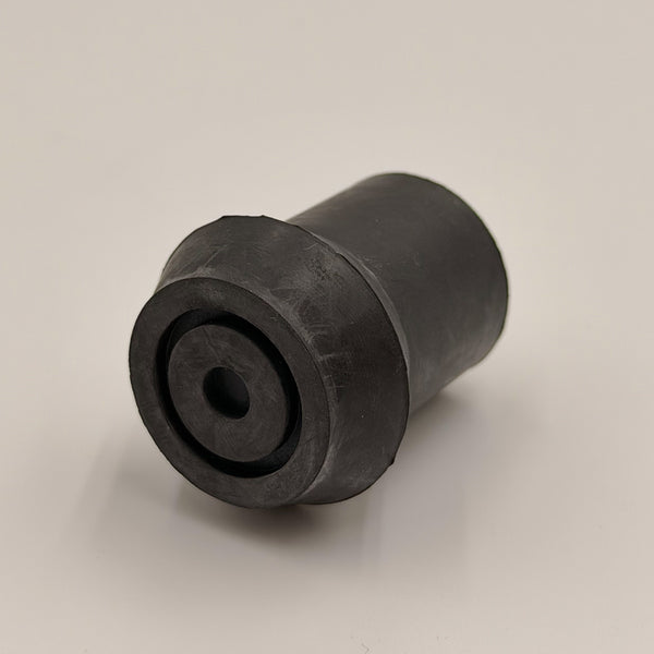 Coopers Walking Stick Ferrule, cylindrical rubber with central hole, shown on a plain surface, close-up view.