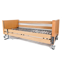 Profiling bed with frame, metal slats, side rails, wheels and electric backrest, mattress not included, side view.